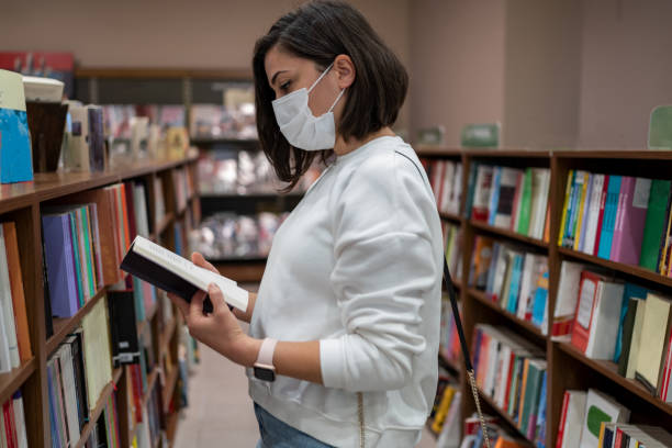 istock Woman In Library 1353546663