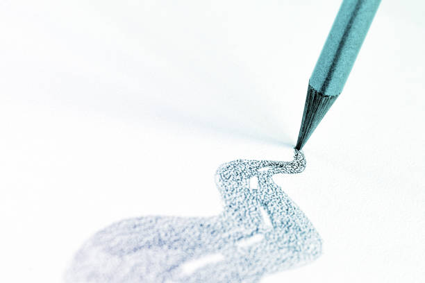 gray graphite pencil draws the road
