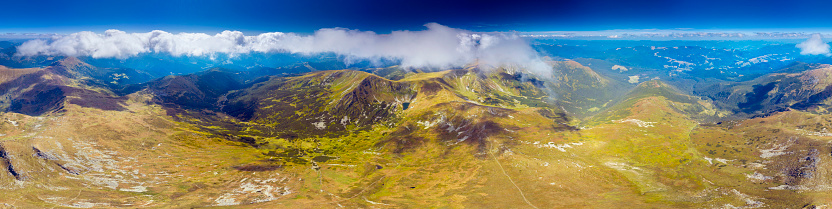 Berbeneskul tract near the lake of the same name. Steep slopes of Montenegro Carpathians in Ukraine with alpine pine, clean springs in wild forests. View from the drone.