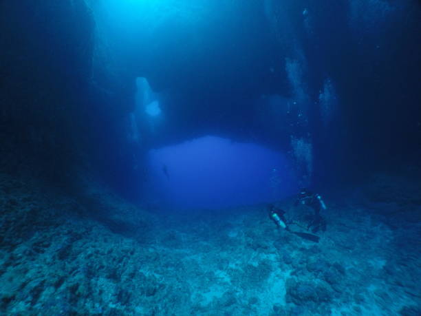 istock Scuba diving at Blue Hole in Palau 1353554224