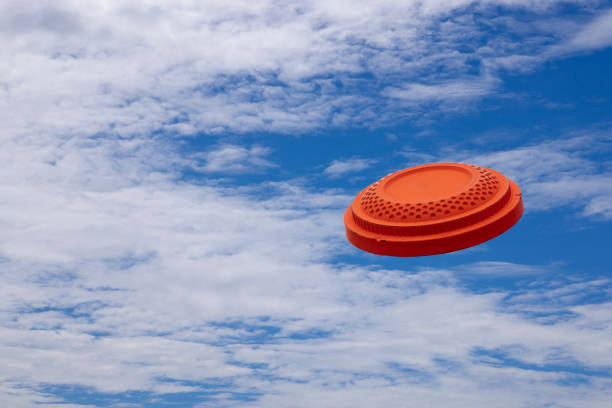 istock Clay disc shooting target on the blue sky , Can be used as a background 1353554420
