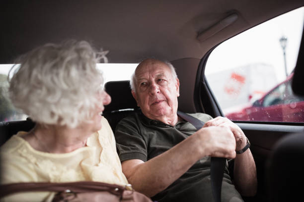 istock Senior couple tourists using taxi 1353555112