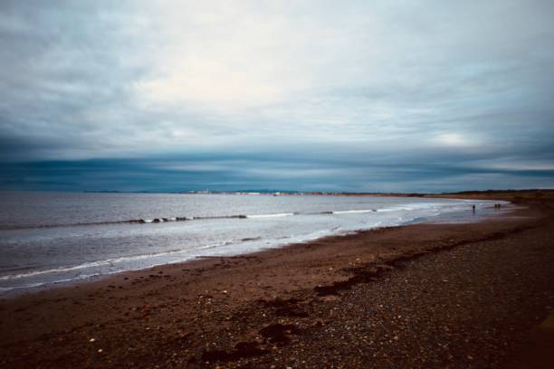 istock Clouds over the sea on the beach 1353555431