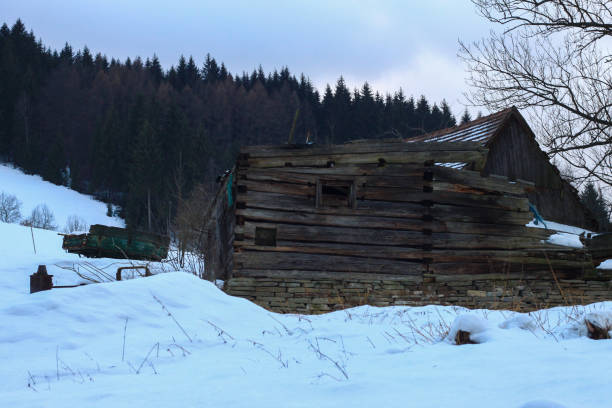 istock A ruined barn in the snow in the mountains. 1353555646