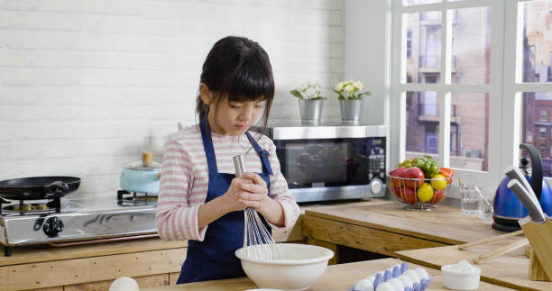 istock cooking and people kid lifestyle 1353556696