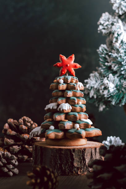 istock Gingerbread Christmas tree on dark table, Christmas card 1353556812