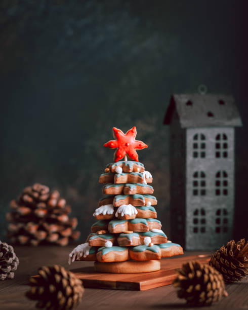 istock Gingerbread Christmas tree on dark table, Christmas card 1353556819
