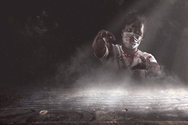 istock Scary zombie with blood and wound on his body standing 1353557989