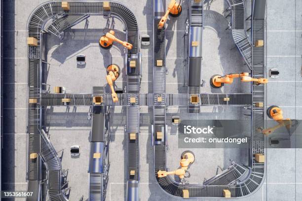 Top View Of Robotic Arms Working On Conveyor Belt In Automatic Warehouse Stock Photo - Download Image Now