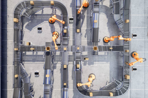 top view of robotic arms working on conveyor belt in automatic warehouse - automatisering bildbanksfoton och bilder