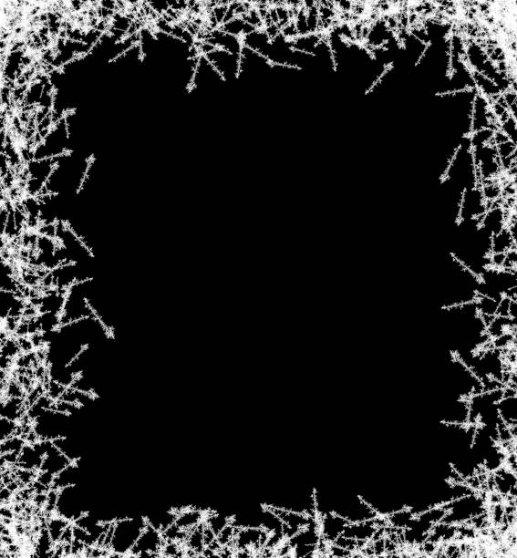 istock A frame of a frosty pattern of ice crystals on a black background. A frame with an abstract ice structure allows you to apply or add a frost effect. Frost on the glass, freezing effect 1353564303