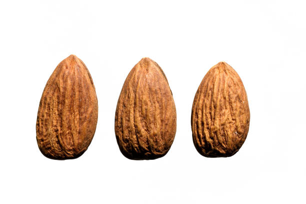 istock several almonds on a white background. close-up. view from above. 1353565488