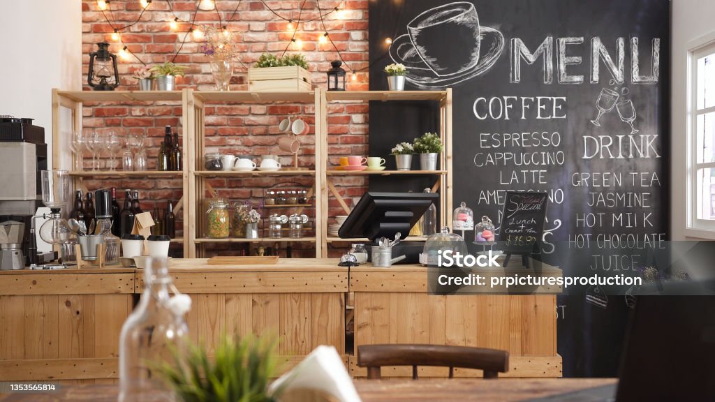 3d render of cafe bar restaurant nobody indoor. Empty coffee shop interior daytime with wooden design counter red brick wall in background. menu writing on blackboard with beautiful letters and cup. Cafe Stock Photo