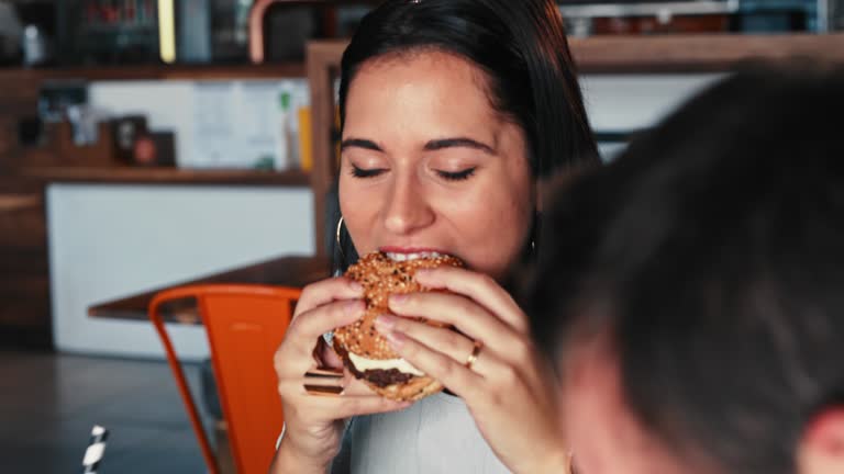 4k video footage of a group of young friends celebrating with burgers together