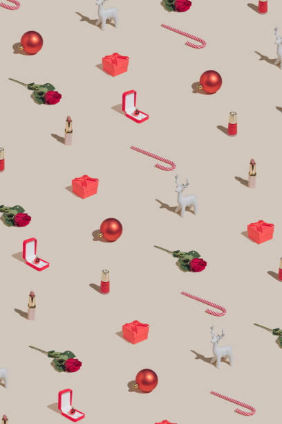 istock Minimal Holiday pattern made with makeup, Christmas decoration, gift box and roses. Vintage aesthetic style. Creative 2022 New Year party concept. 1353566436