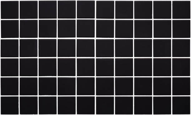 istock Seamless texture of marble black square ceramic tiles. 1353567232