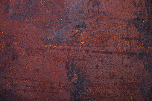 Abstract dirty grunge rusted metal background with rust and oxidized texture. Weathered and cracked surface of iron damaged  wall.