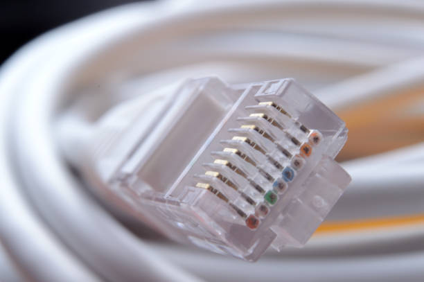 istock connector of a network cable rg 45. close-up. 1353567928