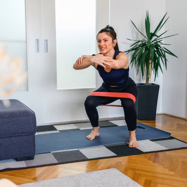 istock Woman exercising at home 1353569640