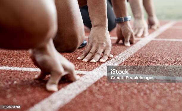 Shot Of A Group Of Athletes Ready To Start A Race Stock Photo - Download Image Now - Beginnings, Starting Line, Running
