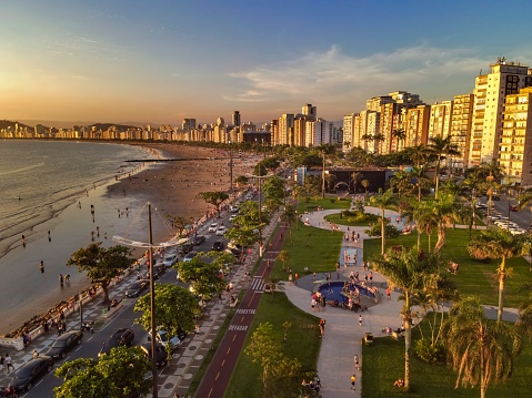Santos, São Paulo, Brazil - November 15, 2021: Aerial view of the Ponta da Praia region and the aquarium crowded with people at sunset.