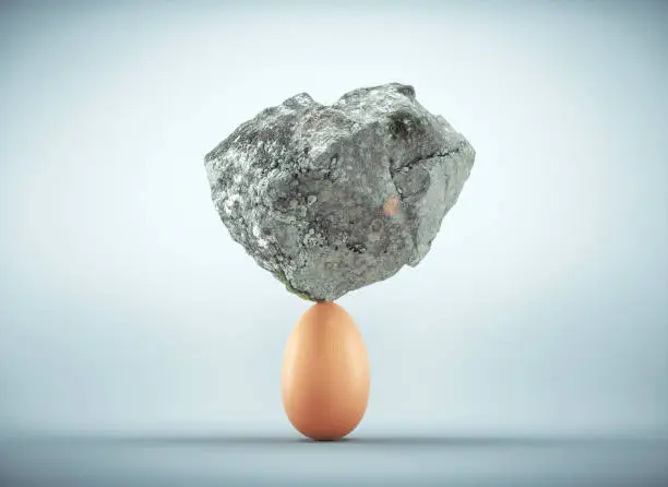 Rock standing on egg.  Unstoppable and strong idea concept. This is a 3d render illustration