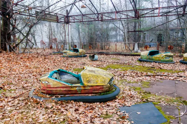 Abandoned bumper cars in the amusement park of Pripyat city in Chernobyl Exclusion Zone, Ukraine