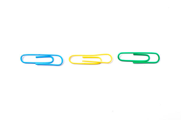 istock Colorful plastic paper clipson on a white background 1353574456