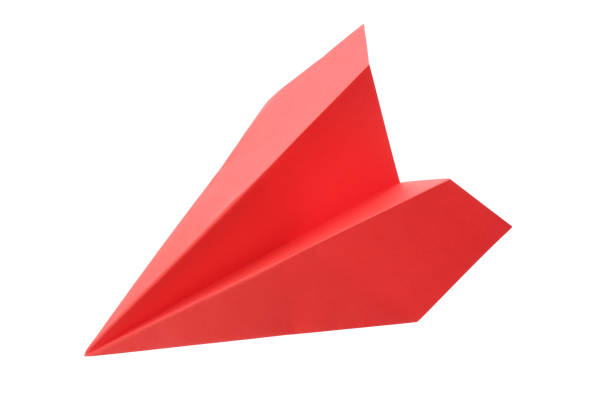 istock Handmade red paper plane isolated on white 1353577026