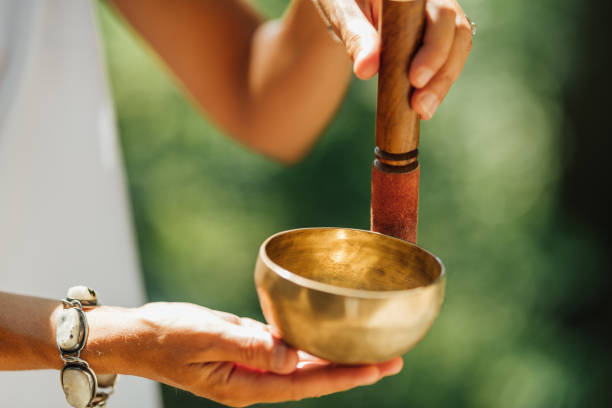istock Hands Holding Tibetan Singing Bowl Outdoors 1353577347