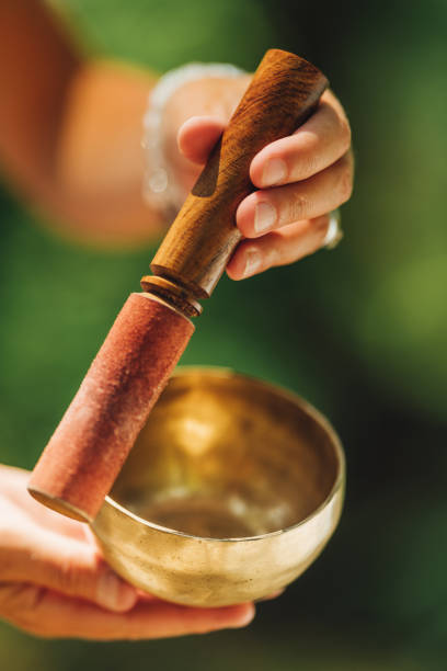 istock Hands Holding Tibetan Singing Bowl Outdoors 1353578757