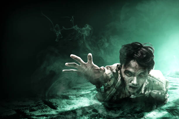 istock Scary zombie with blood and wound on his body crawling 1353580494