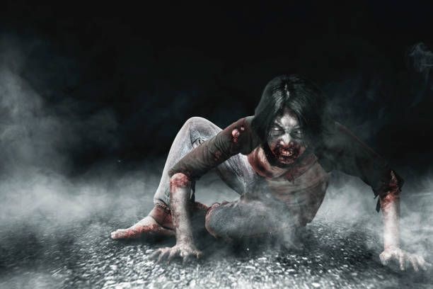 istock Scary zombies with blood and wound on his body crawling 1353580892