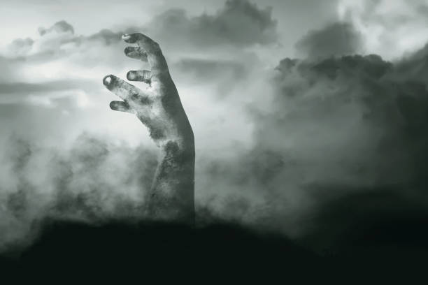 istock Zombie hand with blood and wound raised 1353581739