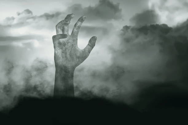 istock Zombie hand with blood and wound raised 1353581772