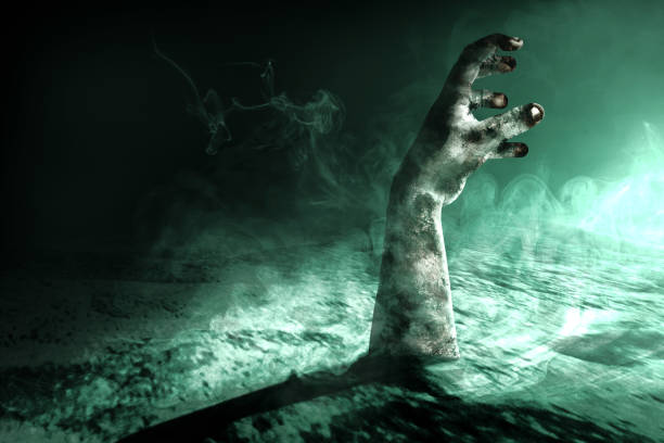istock Zombie hand with blood and wound raised 1353581793