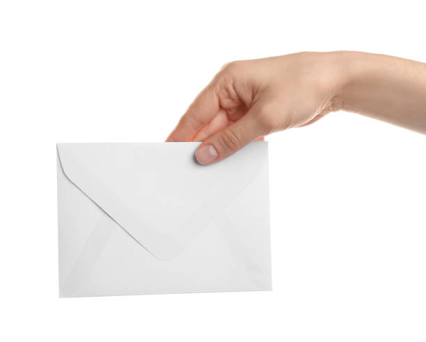 istock Woman holding paper envelope on white background, closeup 1353582048