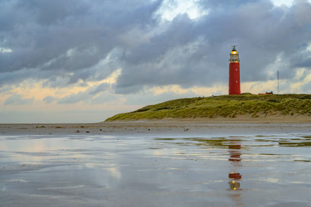 istock Texel lighthouse in the dunes during a stormy autumn evening 1353582233