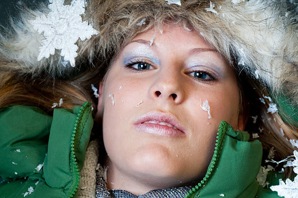 istock beautiful girl with snowflakes at her face 135358229