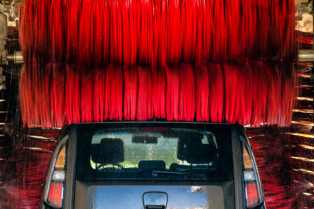istock Cleaning of car in automatic car wash. 1353583082