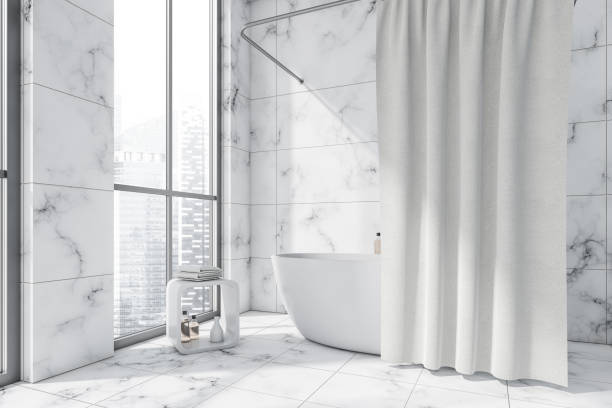 istock Oval white ceramic bathtub with curtain in modern bathroom 1353583637