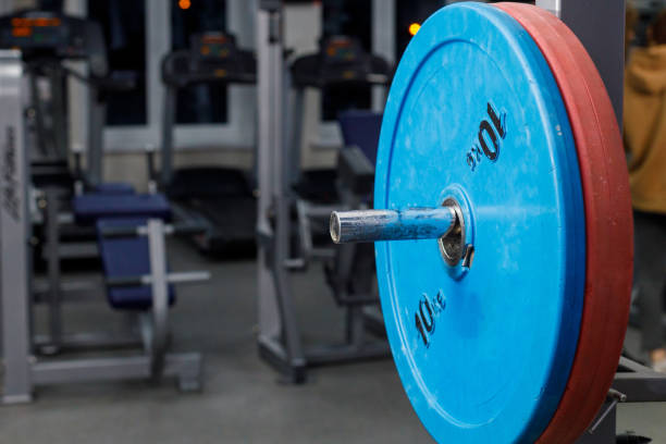 một phần của thanh tạ màu xanh 10 kg, một đĩa lớn cho các môn thể thao sức mạnh - massa tuscany hình ảnh sẵn có, bức ảnh & hình ảnh trả phí bản quyền một lần