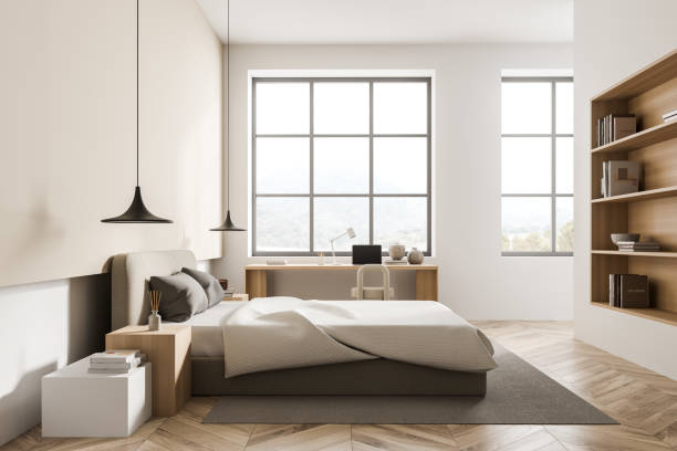 istock Light bedroom interior with bed and workplace near window, mockup 1353584490