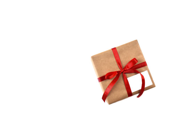istock Gift box wrap brown paper with red ribbon 1353584522