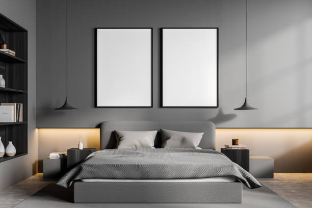 istock Grey bedroom interior with bed and art bookshelf, mockup posters 1353584956