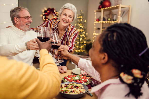 istock Senior friends toasting and Celebrating Christmas together 1353585021