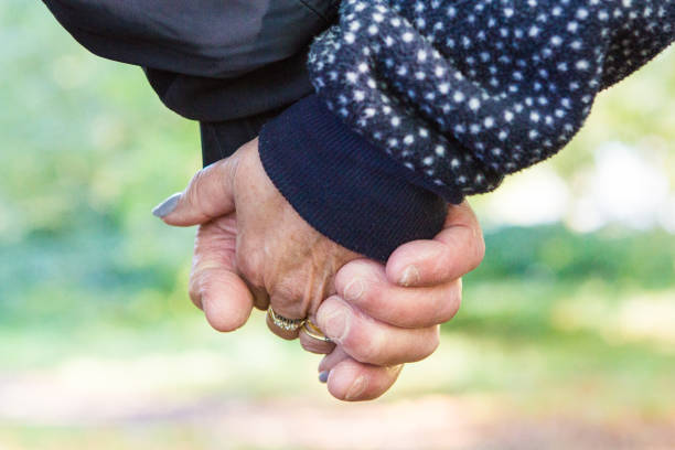 istock Man and a woman holding hands 1353589658