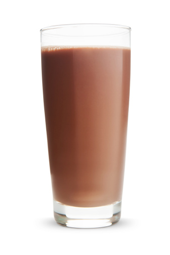 Glass of chocolate milk on white background