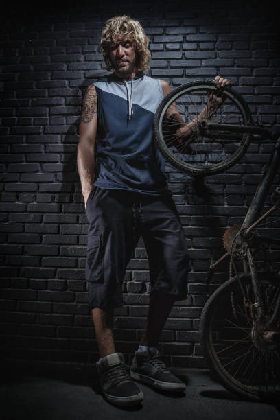 istock Portrait of guy with bicycle 1353590121
