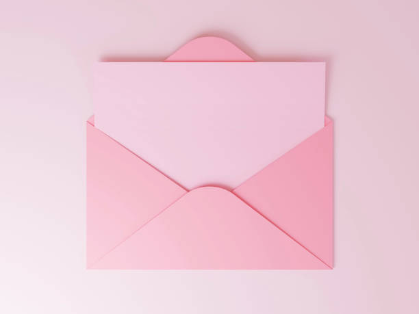 istock Open pink envelope with blank card on pink background 1353590280